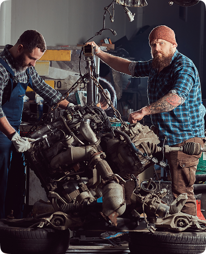 Engine Repair - Expert mechanics servicing tractor engine